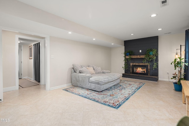 5505 Knollwood Rd, Raleigh, NC 27609 - living room with recessed lighting, a glass covered fireplace, and light tile patterned floors
