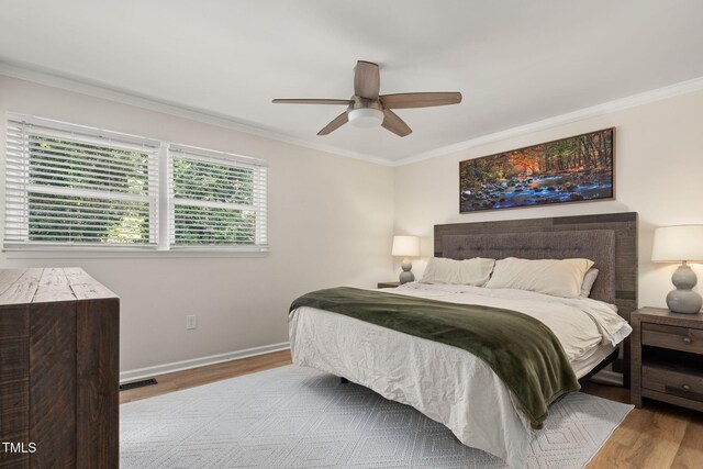 5505 Knollwood Rd, Raleigh, NC 27609 - bedroom with wood finished floors, crown molding, and a ceiling fan