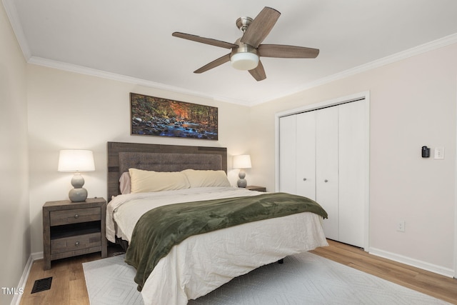 5505 Knollwood Rd, Raleigh, NC 27609 - bedroom with light wood-style floors, ornamental molding, a closet, and ceiling fan