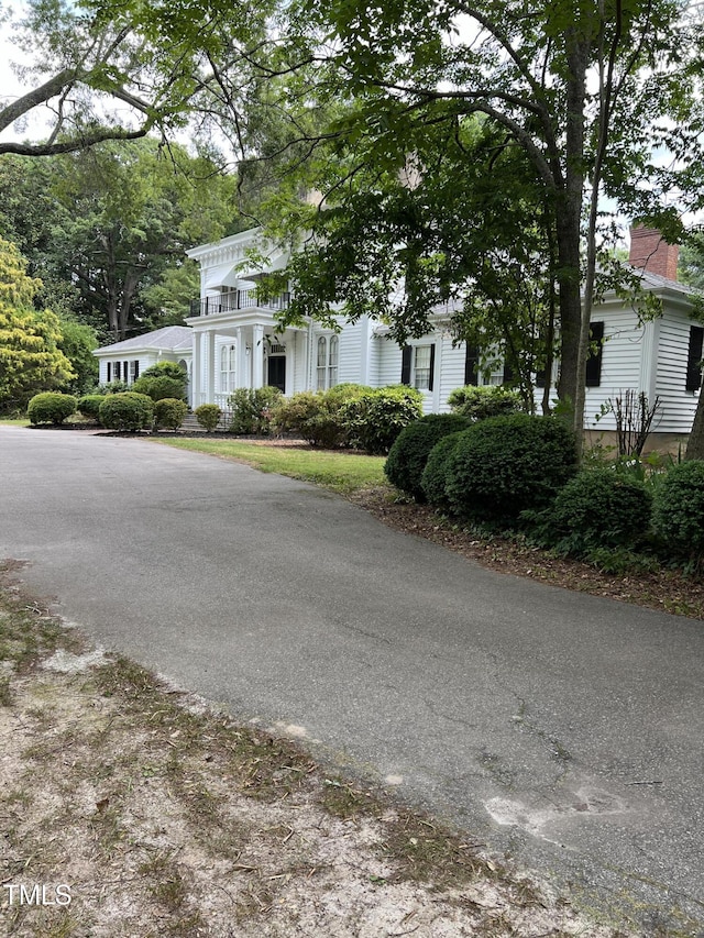 exterior space featuring aphalt driveway