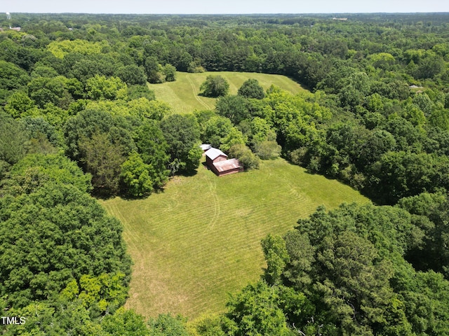 aerial view with a rural view and a wooded view