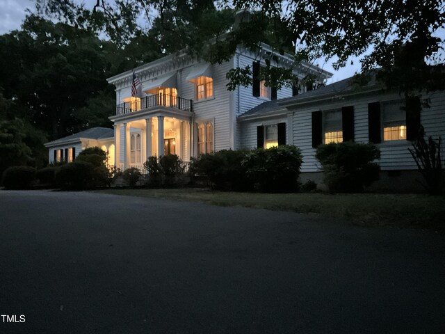 italianate home with a balcony