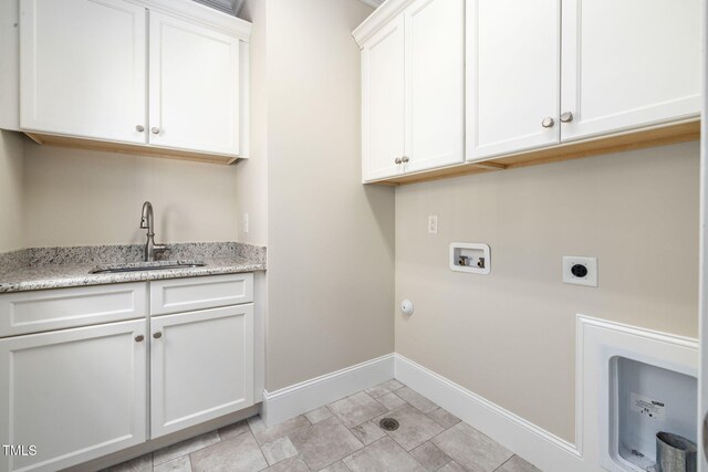 laundry area with cabinet space, electric dryer hookup, washer hookup, baseboards, and hookup for a gas dryer