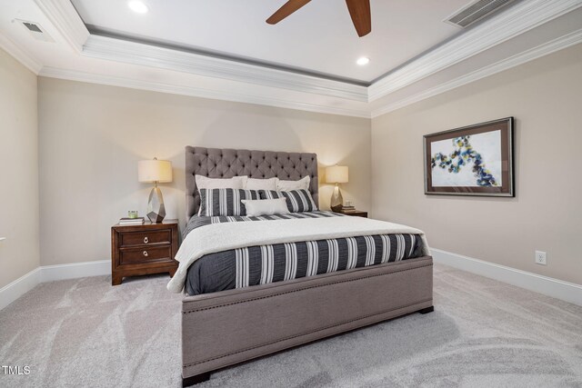 bedroom featuring crown molding, a tray ceiling, carpet floors, baseboards, and recessed lighting