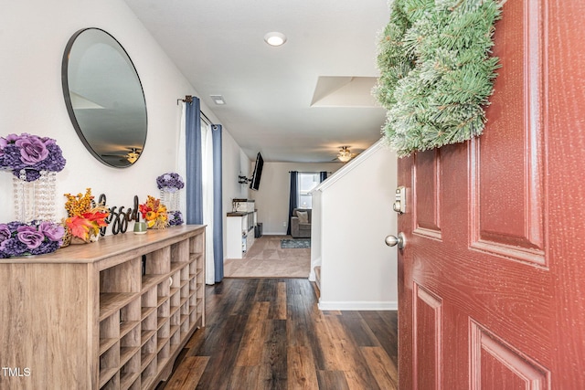 foyer with recessed lighting, baseboards, and dark wood-style floors