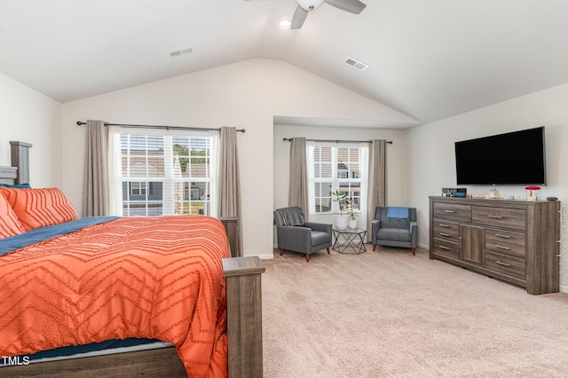 bedroom featuring visible vents, ceiling fan, lofted ceiling, and light carpet