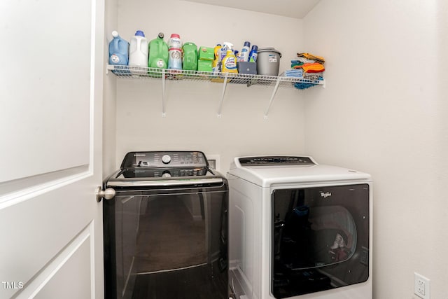 laundry area with laundry area and independent washer and dryer