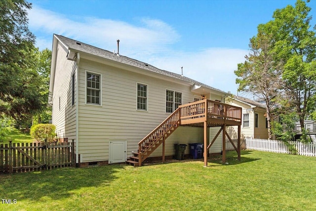 back of house with a fenced backyard, a deck, a lawn, and stairway