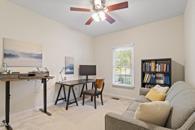 office area featuring baseboards, carpet flooring, ceiling fan, and visible vents