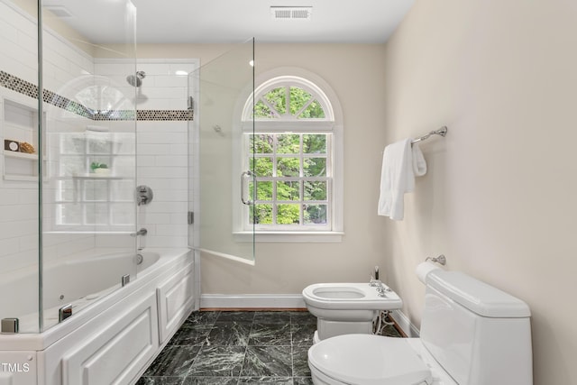 full bath with toilet, marble finish floor, baseboards, a healthy amount of sunlight, and visible vents
