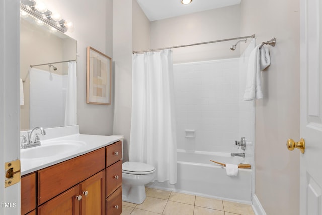 full bath featuring tile patterned flooring, shower / bath combo with shower curtain, toilet, and vanity