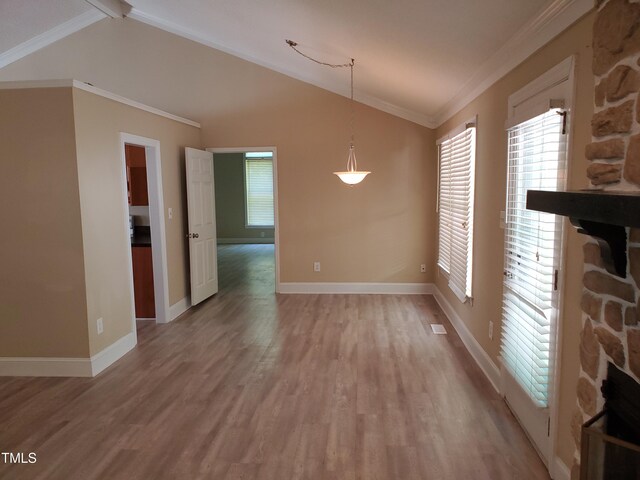 725 Van Thomas Dr, Raleigh, NC 27615 - unfurnished dining area with lofted ceiling, healthy amount of natural light, light wood-type flooring, baseboards, and ornamental molding