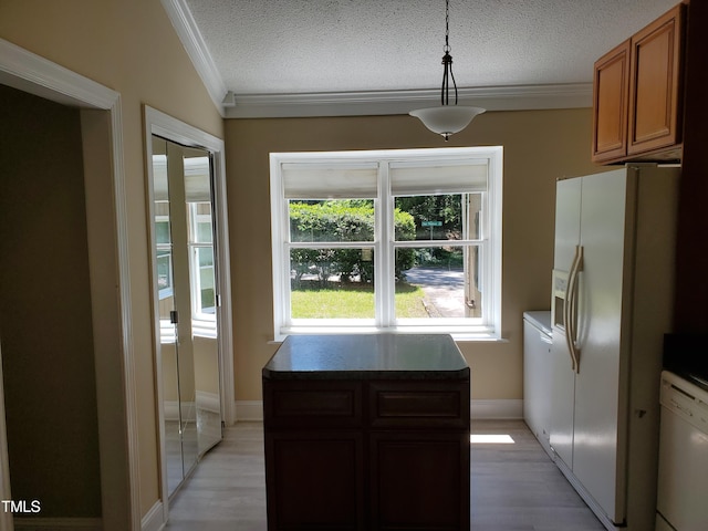 725 Van Thomas Dr, Raleigh, NC 27615 - kitchen with crown molding, white appliances, a textured ceiling, light wood finished floors, and dark countertops
