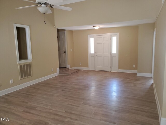 725 Van Thomas Dr, Raleigh, NC 27615 - entryway with ceiling fan, wood finished floors, and baseboards