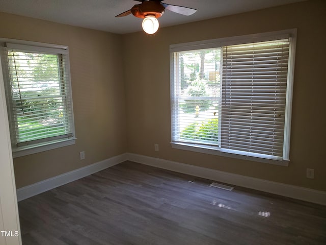 725 Van Thomas Dr, Raleigh, NC 27615 - empty room with healthy amount of natural light, wood finished floors, baseboards, and ceiling fan