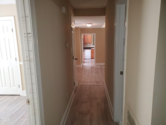 725 Van Thomas Dr, Raleigh, NC 27615 - hallway featuring light wood-style flooring and baseboards