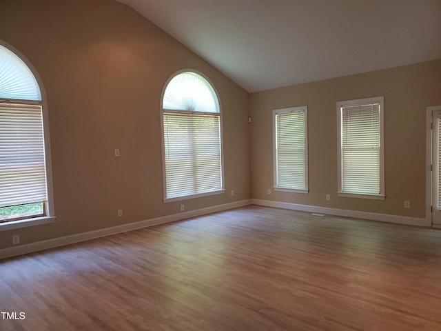 725 Van Thomas Dr, Raleigh, NC 27615 - spare room featuring lofted ceiling, light wood-style floors, and baseboards