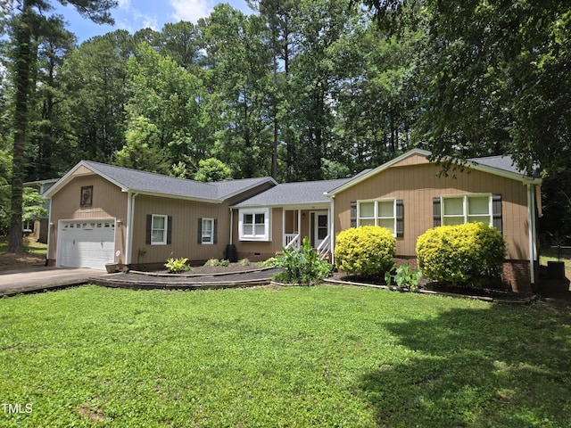 725 Van Thomas Dr, Raleigh, NC 27615 - ranch-style home with an attached garage, a front lawn, and a shingled roof