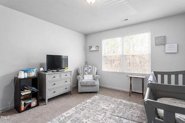 carpeted bedroom with visible vents and baseboards
