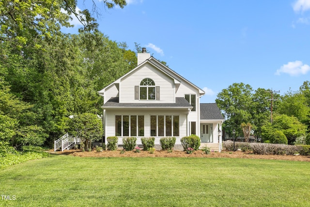 1925 W Lake Dr, Burlington, NC 27215 - rear view of house with a chimney, a yard, and roof with shingles