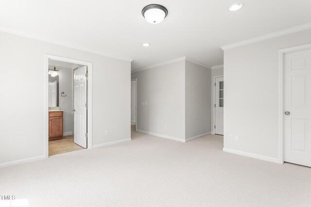 1925 W Lake Dr, Burlington, NC 27215 - unfurnished bedroom with recessed lighting, connected bathroom, baseboards, ornamental molding, and light colored carpet