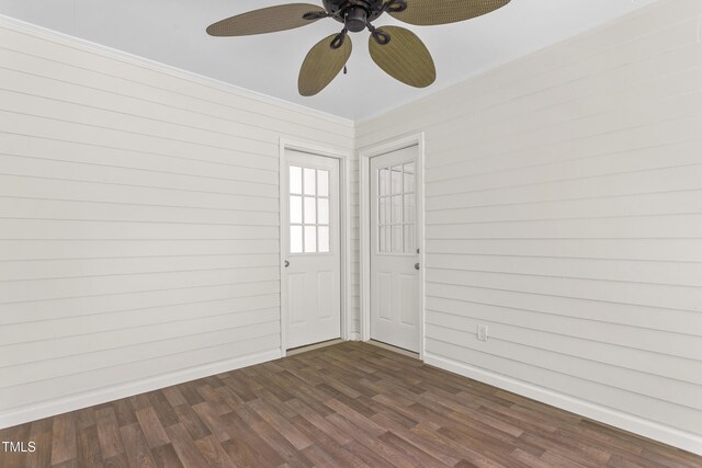 1925 W Lake Dr, Burlington, NC 27215 - unfurnished room with dark wood finished floors, baseboards, ornamental molding, and ceiling fan