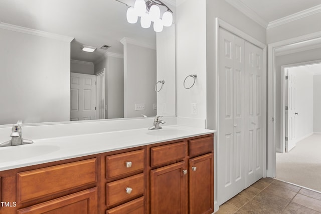 1925 W Lake Dr, Burlington, NC 27215 - bathroom with visible vents, double vanity, crown molding, and a sink