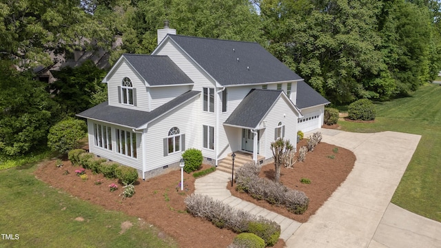 1925 W Lake Dr, Burlington, NC 27215 - view of front of house featuring a front yard, crawl space, a chimney, driveway, and roof with shingles