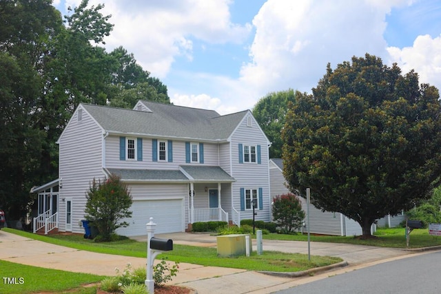 2528 Beech Gap Ct, Raleigh, NC 27603 - traditional home with driveway, a garage, a shingled roof, and a front yard