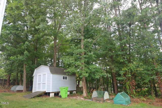 2528 Beech Gap Ct, Raleigh, NC 27603 - view of yard featuring a storage unit and view of wooded area
