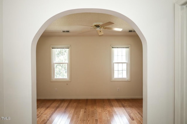 2528 Beech Gap Ct, Raleigh, NC 27603 - unfurnished room featuring ceiling fan, healthy amount of natural light, and light wood finished floors