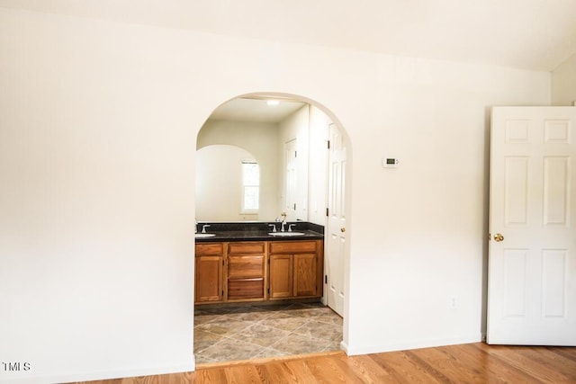 2528 Beech Gap Ct, Raleigh, NC 27603 - bar area with arched walkways and light wood-type flooring