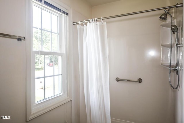 2528 Beech Gap Ct, Raleigh, NC 27603 - bathroom with plenty of natural light and a shower with shower curtain