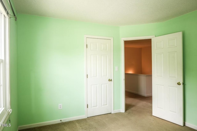 2528 Beech Gap Ct, Raleigh, NC 27603 - unfurnished bedroom with light carpet and baseboards