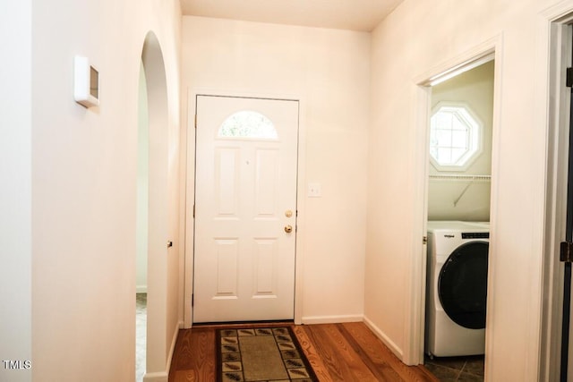 2528 Beech Gap Ct, Raleigh, NC 27603 - washroom with washer / dryer, wood finished floors, and arched walkways