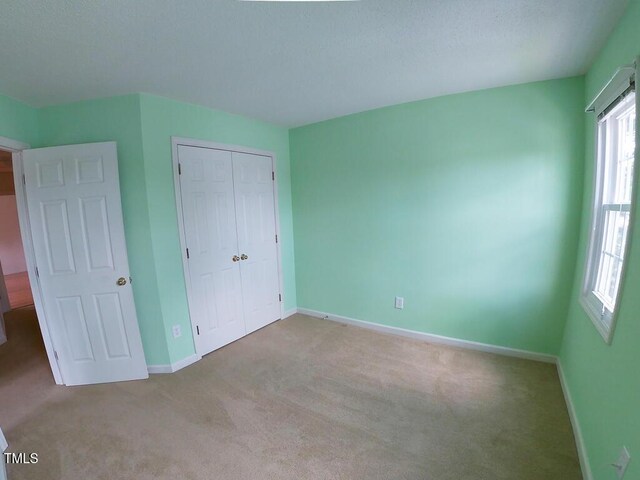 2528 Beech Gap Ct, Raleigh, NC 27603 - unfurnished bedroom featuring carpet and a closet