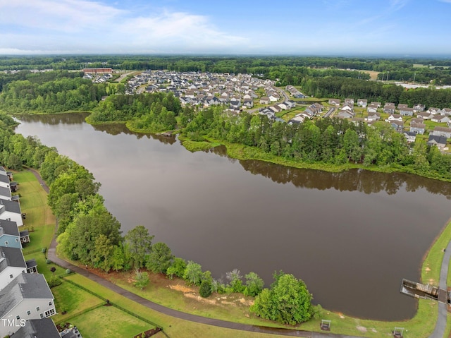 aerial view of residential area with a nearby body of water