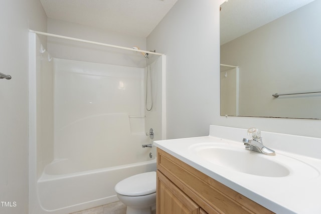 bathroom with bathtub / shower combination, vanity, and toilet