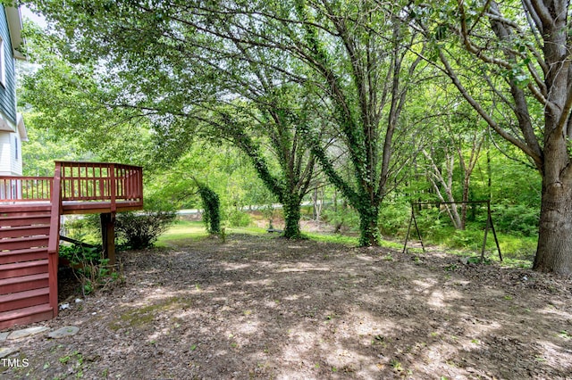 view of yard featuring a wooden deck