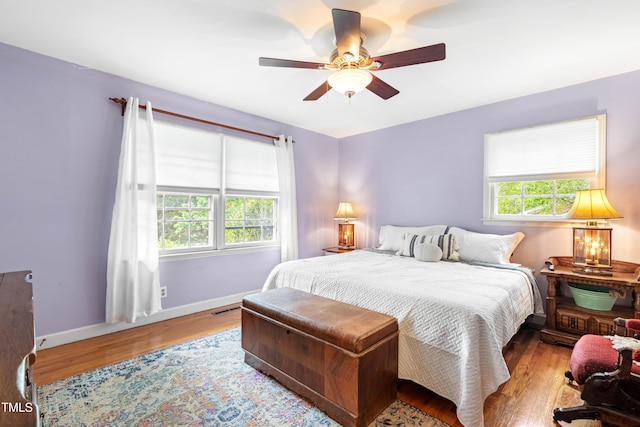 149 Baldwin Dr, Durham, NC 27712 - bedroom featuring wood finished floors, a ceiling fan, visible vents, and baseboards