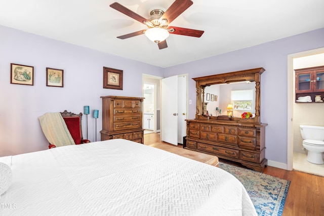 149 Baldwin Dr, Durham, NC 27712 - bedroom with wood finished floors, ensuite bathroom, a ceiling fan, and baseboards