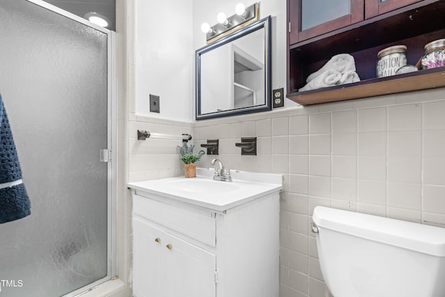 149 Baldwin Dr, Durham, NC 27712 - full bathroom with toilet, vanity, a shower stall, and tile walls