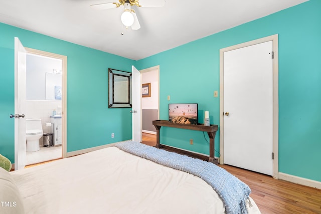 149 Baldwin Dr, Durham, NC 27712 - bedroom featuring wood finished floors, ceiling fan, ensuite bath, and baseboards