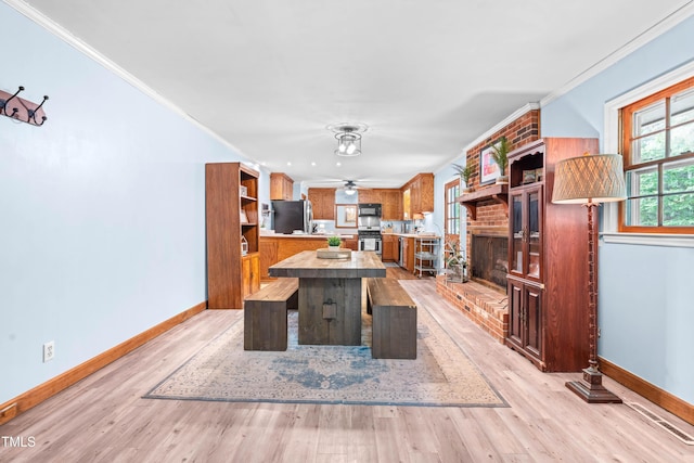 149 Baldwin Dr, Durham, NC 27712 - interior space with open shelves, appliances with stainless steel finishes, brown cabinets, baseboards, and crown molding