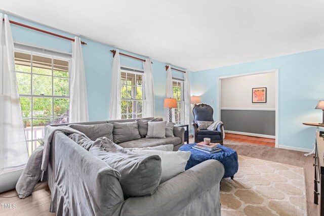 149 Baldwin Dr, Durham, NC 27712 - living room featuring wood finished floors and baseboards