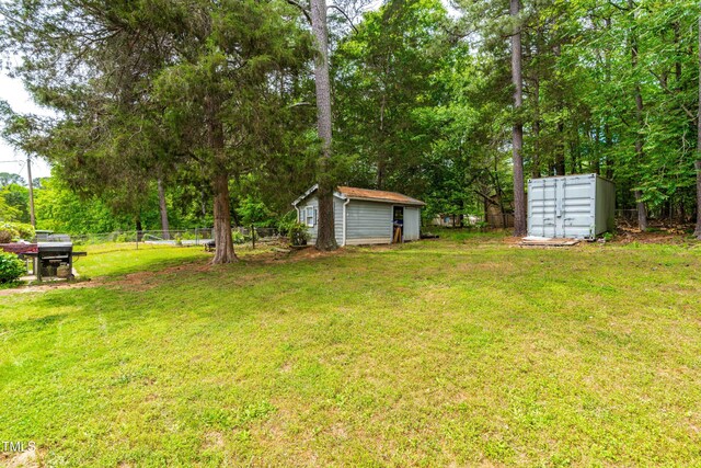 149 Baldwin Dr, Durham, NC 27712 - view of yard with an outdoor structure, a storage shed, mail area, and fence