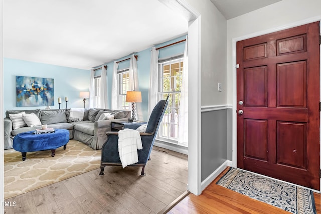 149 Baldwin Dr, Durham, NC 27712 - foyer with baseboards, visible vents, and wood finished floors