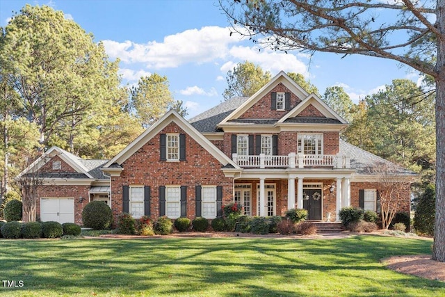 1317 Colonial Club Rd, Wake Forest, NC 27587 - view of front of home with a front lawn, a porch, brick siding, and a balcony