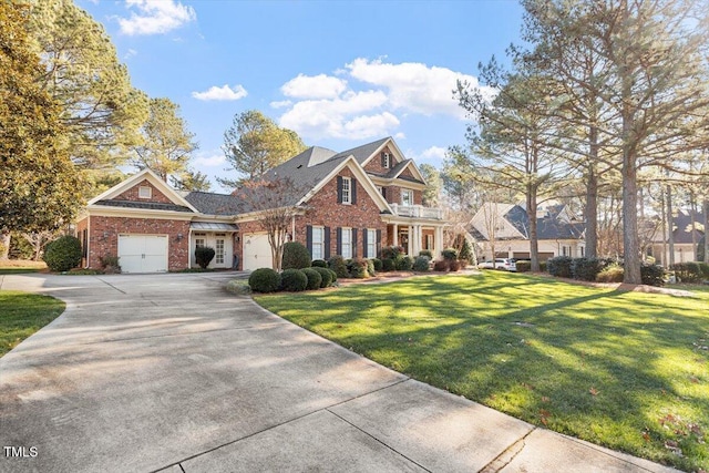 1317 Colonial Club Rd, Wake Forest, NC 27587 - view of front facade featuring brick siding, a garage, a front yard, and concrete driveway