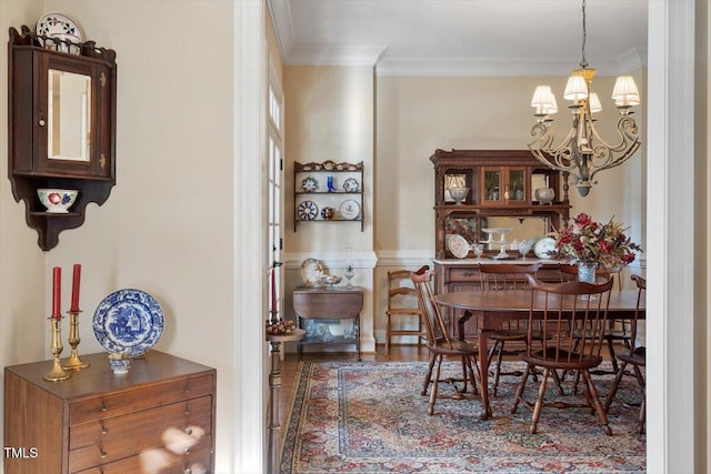 1317 Colonial Club Rd, Wake Forest, NC 27587 - dining space featuring wood finished floors, crown molding, and a notable chandelier